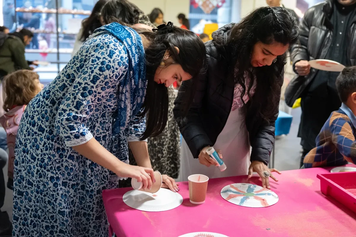 Two people take part in a crafting workshop