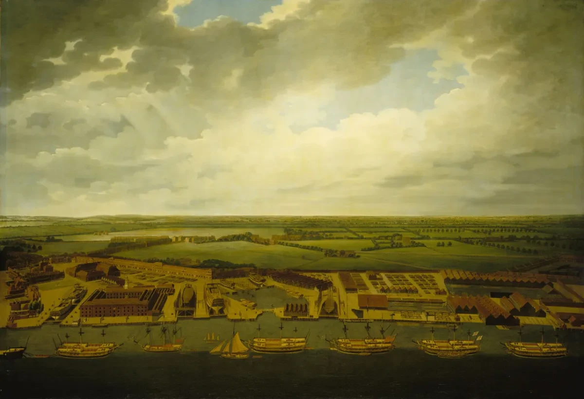 18th century view of Deptford Dockyard. The aerial perspective allows you to see the various wharves, buildings and docks that make up the facility, with the River Thames lined with ships in the foreground and open fields in the background