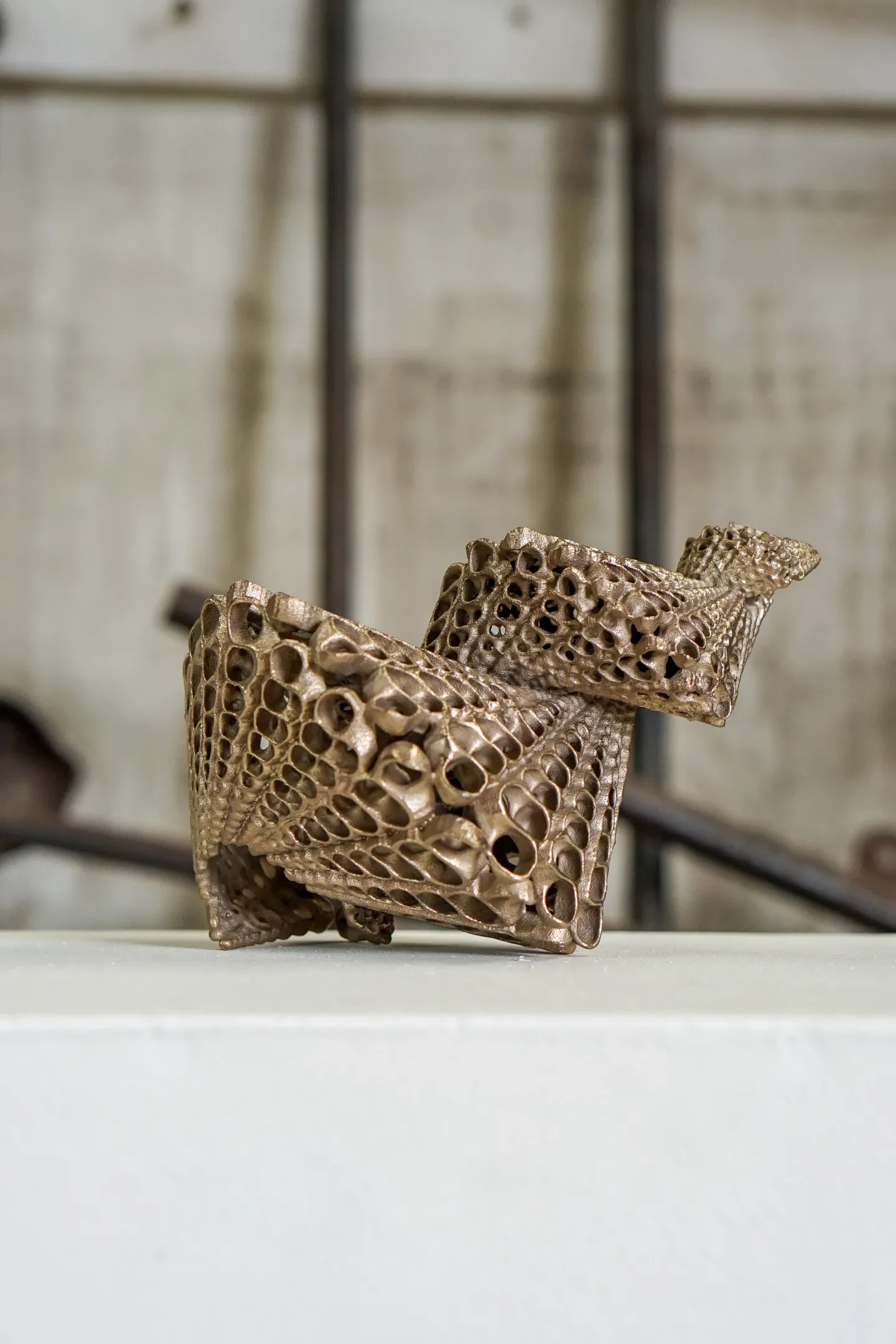 A bronze shell-like sculpture made by artist Rowan Mersh