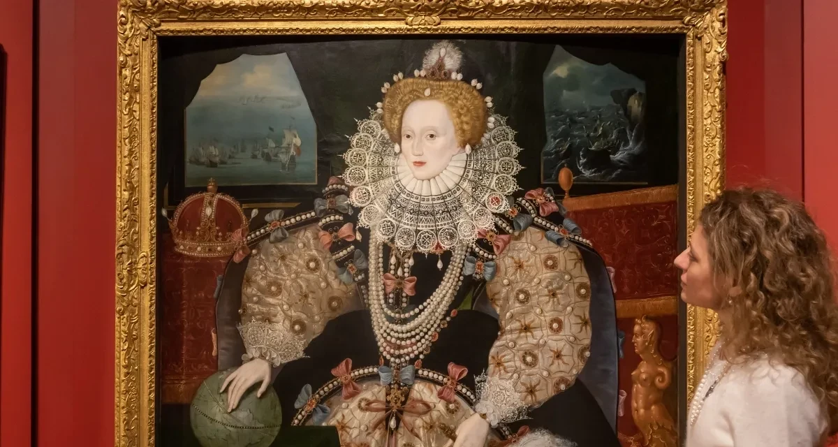A visitor looks at the Armada portrait of Elizabeth the first.