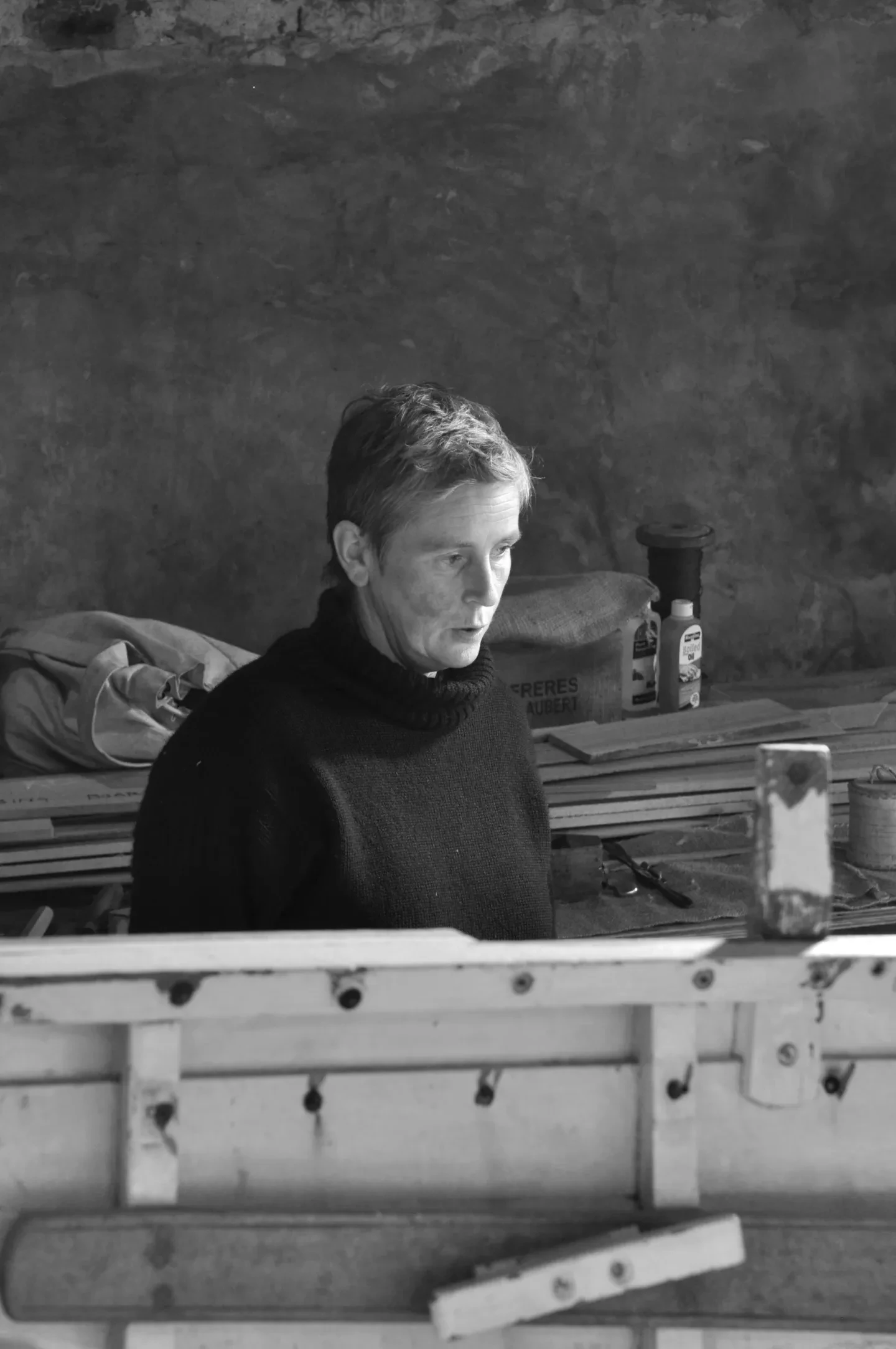 Image of Gail McGarva constructing a wooden boat