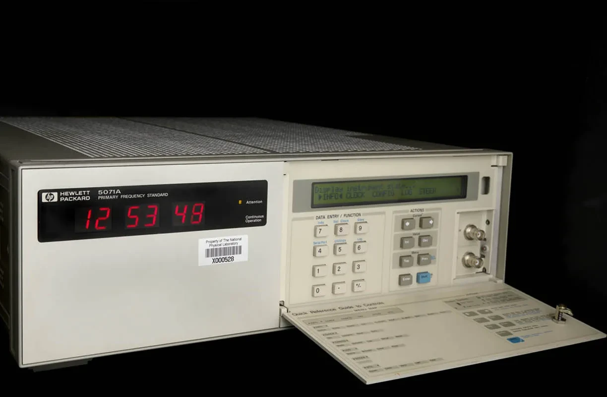 A white electronic device with number pad and digital display.