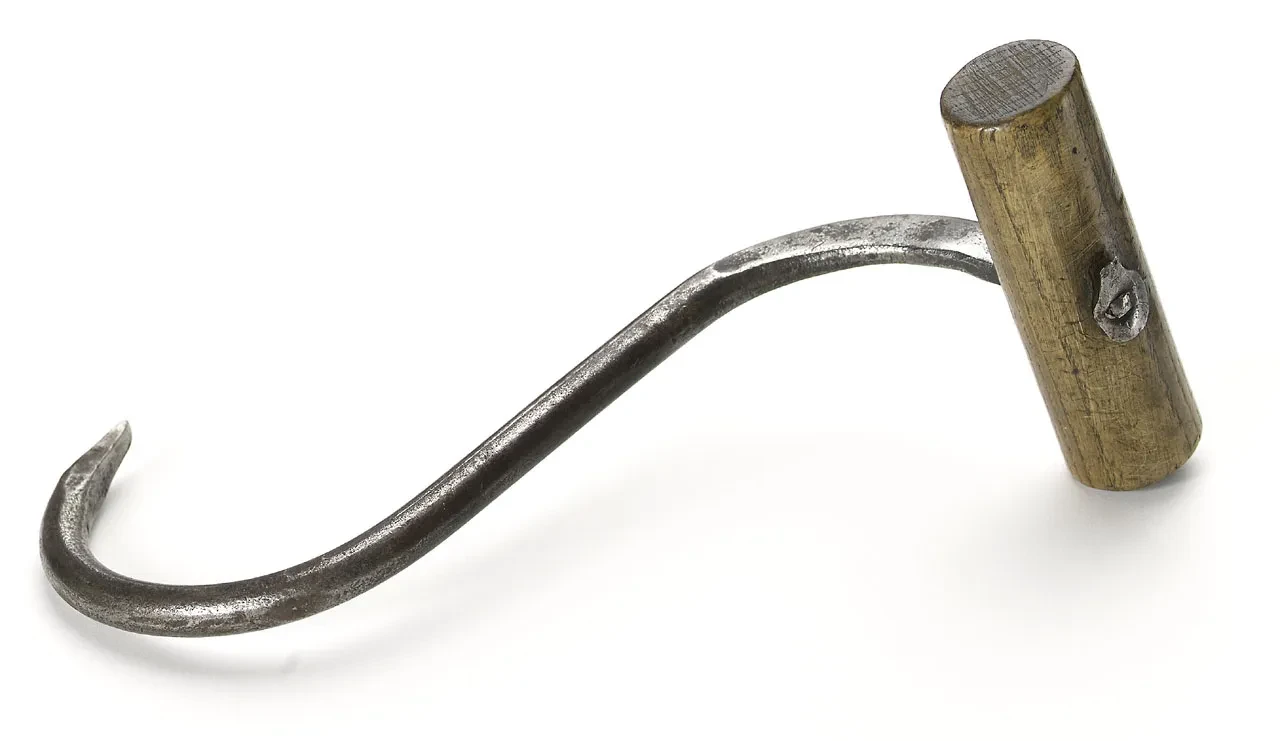 A metal hook with a wooden handle