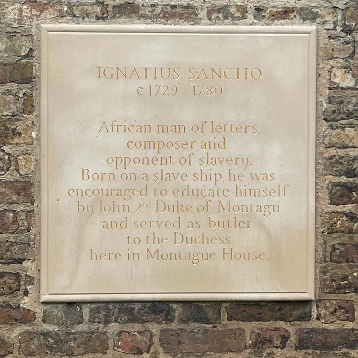 Plaque commemorating Ignatius Sancho in Greenwich Park. The dedication reads: 'IGNATIUS SANCHO - c1729-1780 - African man of letters, composer and opponent of slavery. Born on a slave ship he was encouraged to educate himself by John 2nd Duke of Montagu and served as butler to the Duchess here in Montague House.'