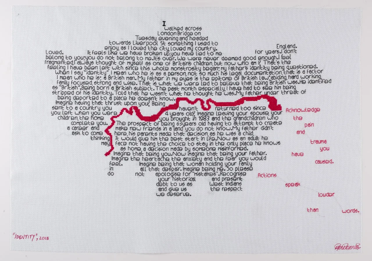 An embroidered map of London and the Thames, with words reflecting on British identity, racism and government policy stitched in around the river