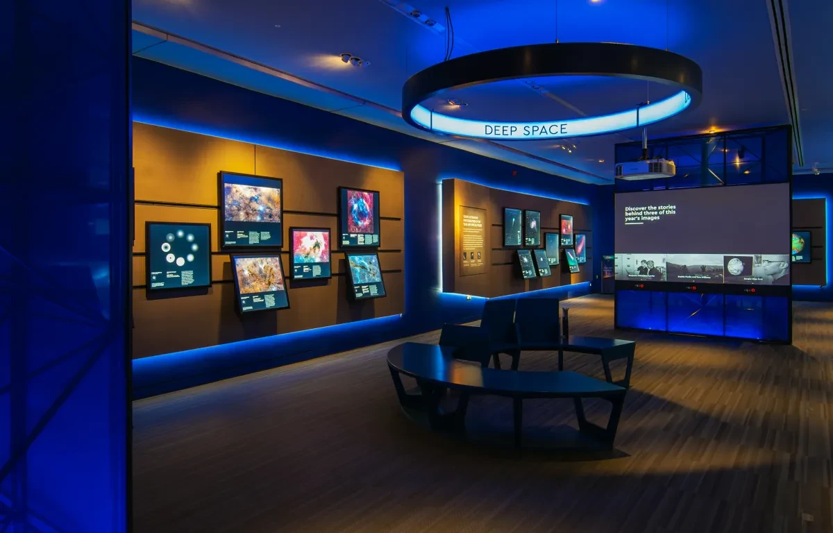 Photo of gallery displaying astrophotography images.