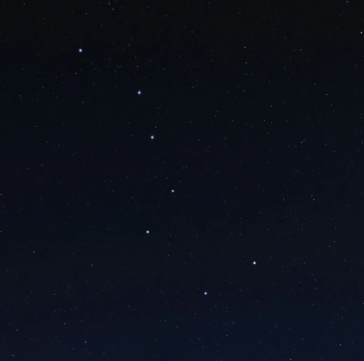 Image of dark night sky with 7 bright stars in a shape that resembles a diagonal saucepan with a handle
